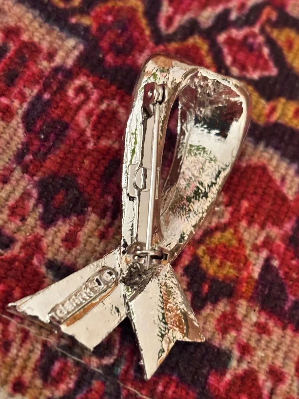 Silver Ribbon Brooch with Light Blue Stones